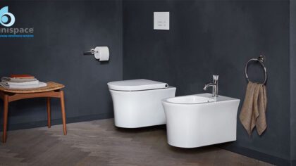 Modern bathroom interior with wall-mounted toilet and bidet by Unispace
