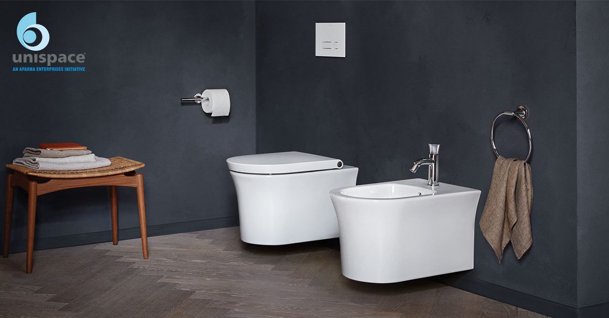 Modern bathroom interior with wall-mounted toilet and bidet by Unispace